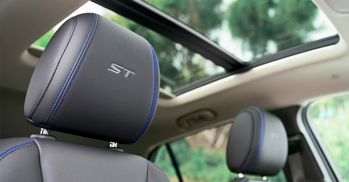 2025 Buick Encore GX seat headrest with ST logo and sunroof in the background