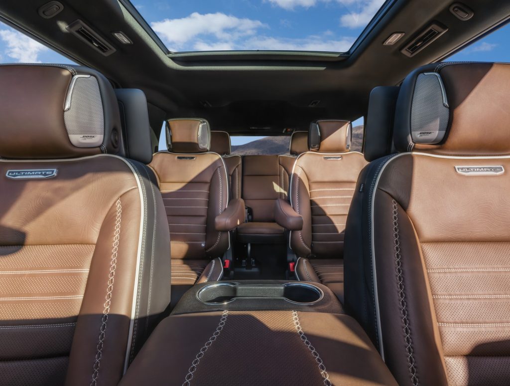 2026 GMC Yukon Denali Ultimate front view to rear passenger seats showing BOSE in headrests and view of sunroof