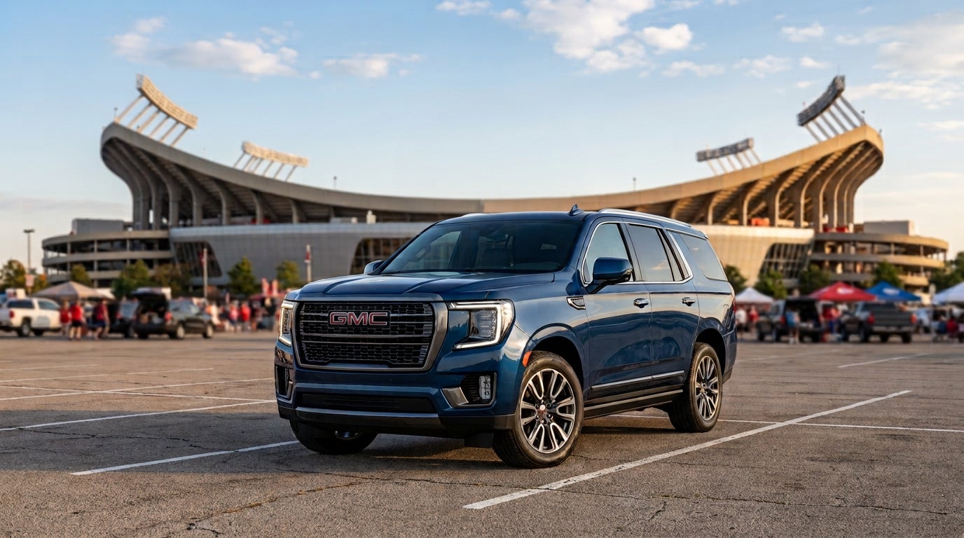 GMC Yukon parked outside of a football stadium